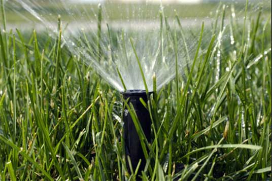 Water Sprinkler System on in the grass