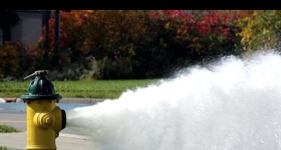 a fire hydrant flushing water 